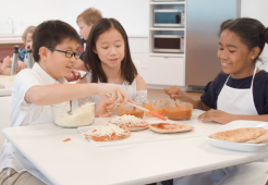 Kids in classroom learning about healthy food and the nutrition information they need to build life-long healthy habits